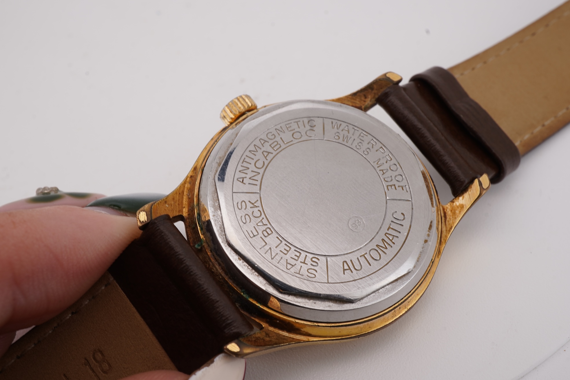 A gentleman's steel and gold plated Montfort Superautomatic wrist watch, with Roman and quarterly Arabic numerals, case diameter 34mm, on a later associated leather strap.